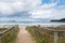 Entrance to the beach. Inviting summertime holiday beach background