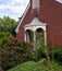 Entrance to Brick Church With White Portico