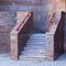 Entrance to the building, porch tiled with artificial marble with stone steps