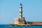 Entrance to Chania harbor with lighthouse, Crete, Greece