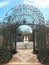 Entrance to the city park. Wicker arch with interesting ornaments.