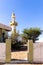 Entrance to demolished old mosque with minaret buried in sand in ghost village Al Madam in Sharjah, United Arab Emirates