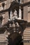 Entrance to historic GPO building, built 1866-1874 with Queen Victoria supported by classical allegories and coat of arms over the