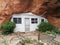 Entrance to Hole N` The Rock mountain home with vivid green plants