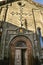 Entrance to the `Holy sign` church with a patterned carved portal and a cross above the door in the city of Gyumri