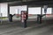 Entrance to a multi-storey car park or parking garage with barriers and parking ticket columns, traffic concept for many vehicles