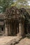 Entrance to ruined temple with decorated portico