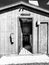 Entrance to a rural campground laundromat with a washer and dryer.