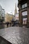 Entrance to Stephansplatz with St. Stephen`s Cathedral, metal coffee table with raindrops in Wien downtown