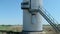 Entrance to tower of wind turbine with stairs and door