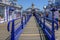 Entrance to the Victorian Tea Room which is on the Pier in Eastbourne. Strong blue railing lead in lines