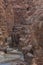 Entrance to the Wadi Mujib canyon in Jordan. Steep rocks and a rapid flowing river carved. Difficult crossing and attraction for