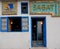 Entrance traditional Tunisian coffee bar, colourful tiles, blue door