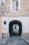 Entrance tunnel of old brick. Dark arched doorway