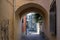 Entrance tunnel of old brick. Dark arched doorway