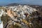 Entrance of white house and sunset in town of Imerovigli, Santorini island, Thira, Greece