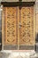 Entrance wooden door with carved elements of ethnic ornament in the church of St.Marin in the city of Ashtarak