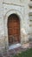 Entrance wooden door to the monastery from the last century