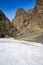 Entrance of the Yolyn Am or Yoliin Am canyon in spring, Gobi Gurvansaikhan National Park. Gobi desert, Mongolia