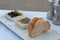 Entree, starter meal of bread with olive oil and balsamic vinegar and olives