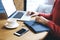 Entrepreneur browsing laptop while sitting on coffee break