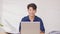 Entrepreneur handsome business asian man wear blue shirt finish working online close computer laptop on desk table smile and