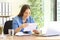 Entrepreneur woman reading a letter at office