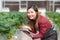 Entrepreneur young asian woman check cultivation strawberry with happiness for research with digital tablet.