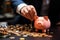 Entrepreneurial hand deposits a coin into the piggy banks slot