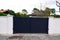 Entry modern dark grey high gate aluminum portal to home access