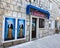 Entry to the souvenir shop in the Croatian town of Pag with the traditional features of a woman in traditional costume on the