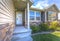 Entryway of a home with stairs and a sunny yard