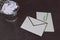 Envelope with clip symbol of email and attachments with trash can next to it