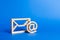 Envelope and email symbol on a blue background. Concept email address. Internet technologies and contacts for communication.