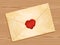 Envelope with heart wax seal wood background