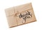 Envelope kraft paper tied with string on a white background and text Thank you. Calligraphy lettering hand draw