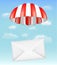 Envelope mail with parachute on sky background