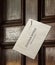 Envelope nailed to wooden door with eviction notice