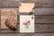 Envelope, postcard and mask on a wooden background.