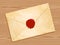 Envelope with wax seal wood background