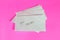 Envelope with word your SALARY isolated on pink background