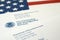 Envelopes with letter from USCIS on United States flag from Department of Homeland Security