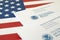 Envelopes with letter from USCIS on United States flag from Department of Homeland Security