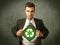 Enviromentalist business man tearing off shirt with recycle sign