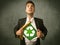 Enviromentalist business man tearing off shirt with recycle sign