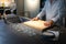 Environment of Asian Chef who lays his hand on wood cutting board shows sign of readiness for cooking menu today