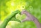 Environment earth day, Heart shaped by nature hands and female with circular economy icon of eco infinity , Loving the environment