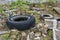 Environment and ecology. Car tires and construction debris dumped on the ground