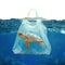 Environmental concept plastic bag holds blurred turtle toy in water
