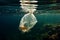 Environmental crisis Plastic bag submerged beneath the surface of the sea